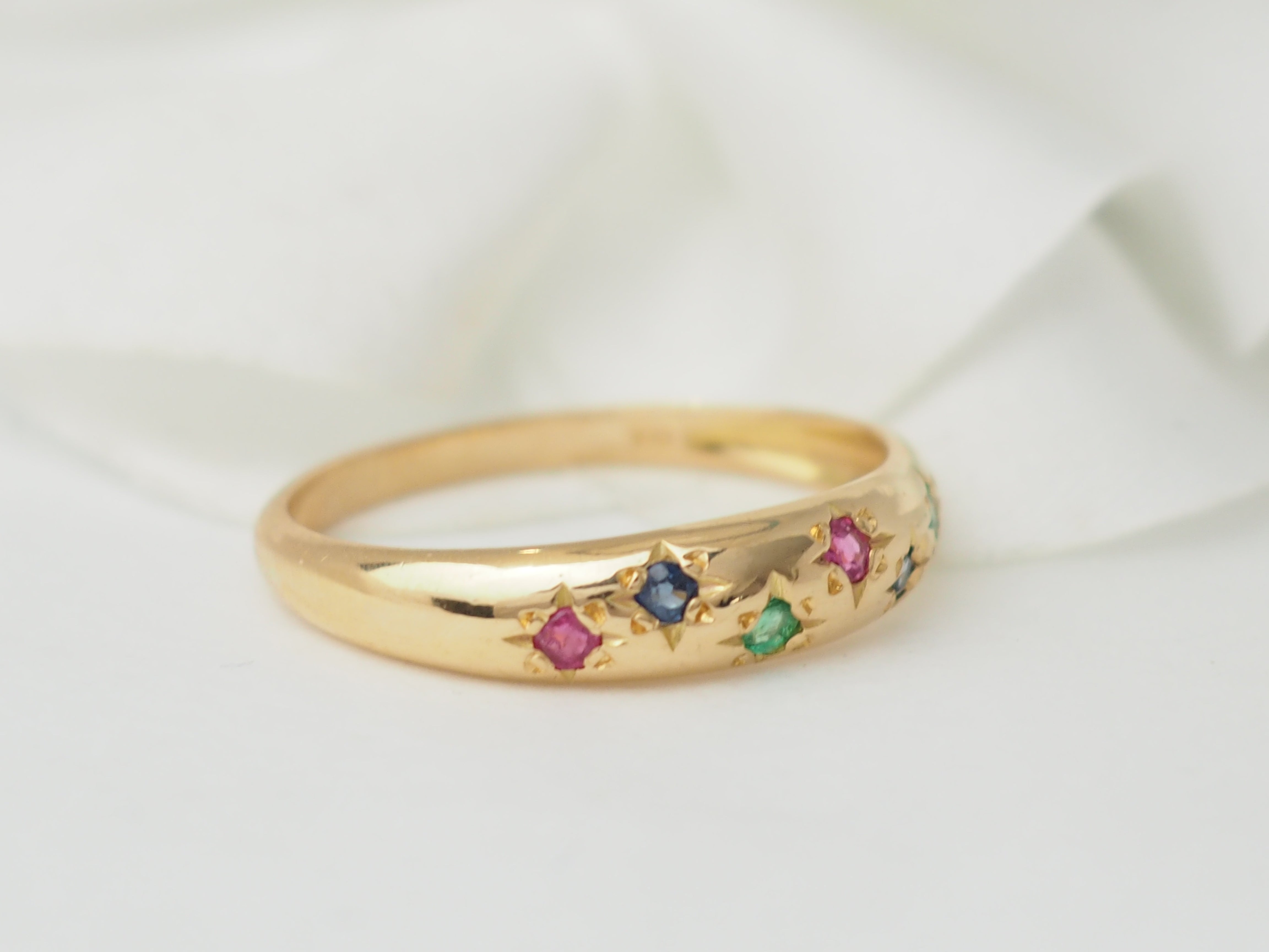 Bague jonc en or rose et pierres précieuses