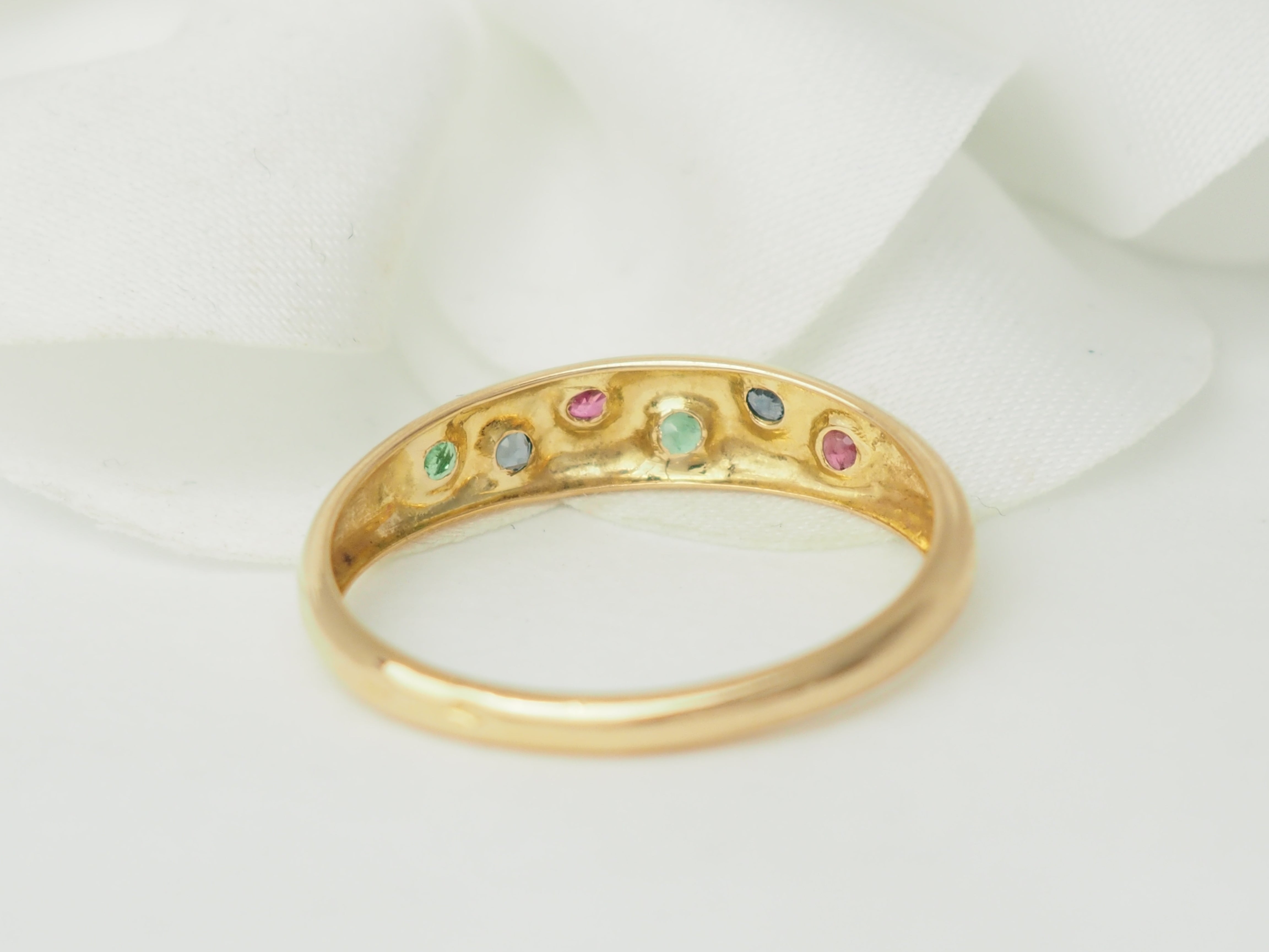 Bague jonc en or rose et pierres précieuses