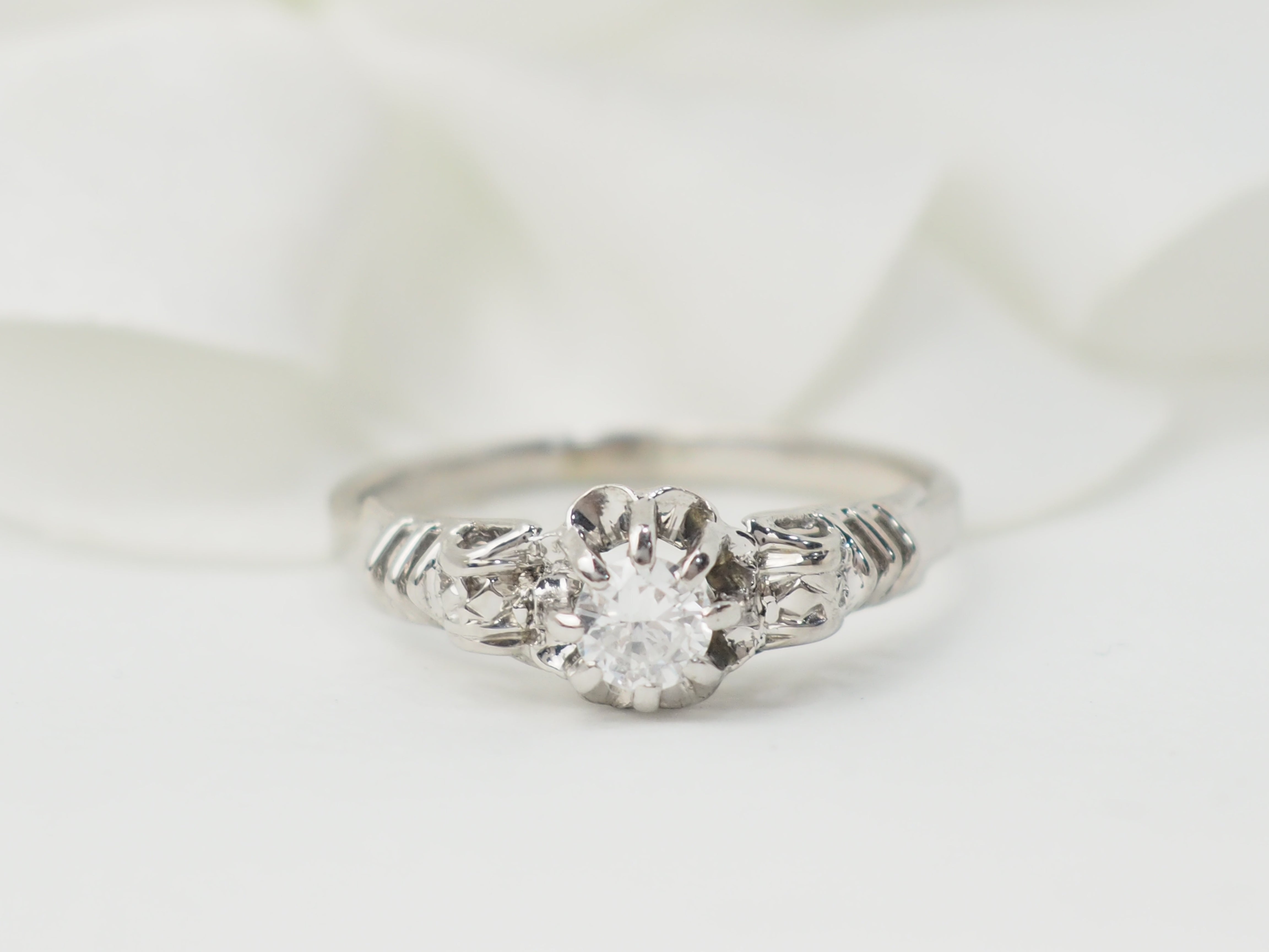 Bague solitaire en or blanc et platine, diamant 0,23ct