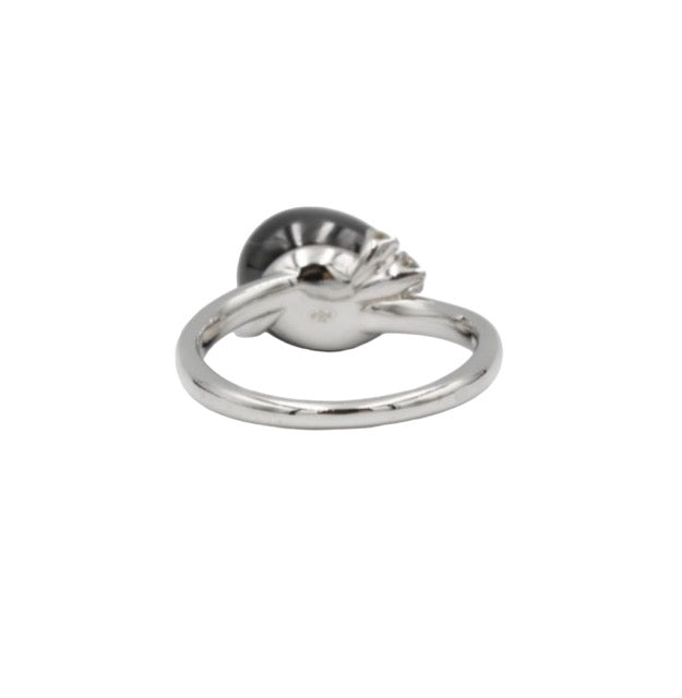 Pomellato, "Capri" ring in 18k white gold set with a black ceramic pearl and 3 diamonds