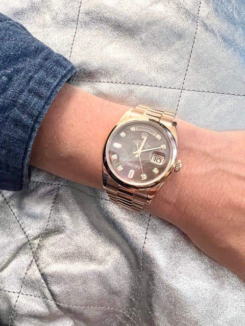 A Rolex Day Date rose gold watch with Tahitian mother-of-pearl dial