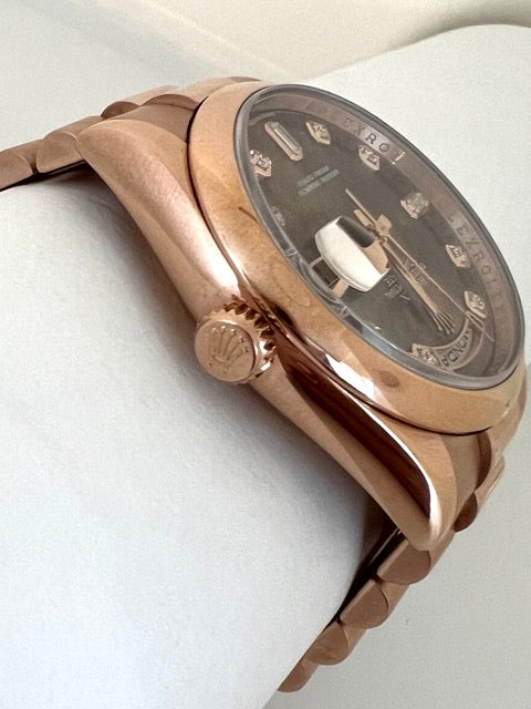 A Rolex Day Date rose gold watch with Tahitian mother-of-pearl dial