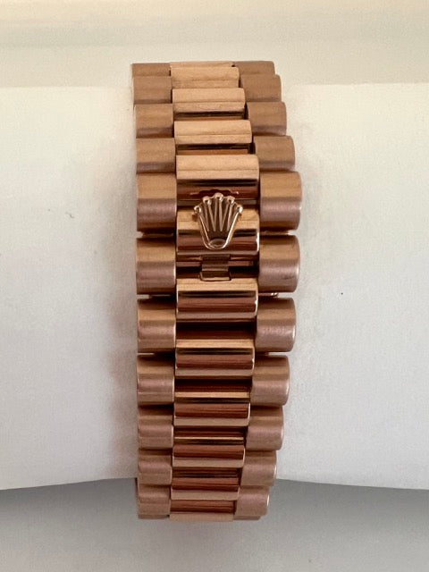 A Rolex Day Date rose gold watch with Tahitian mother-of-pearl dial