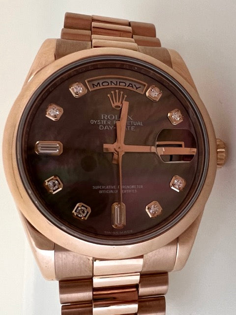 A Rolex Day Date rose gold watch with Tahitian mother-of-pearl dial