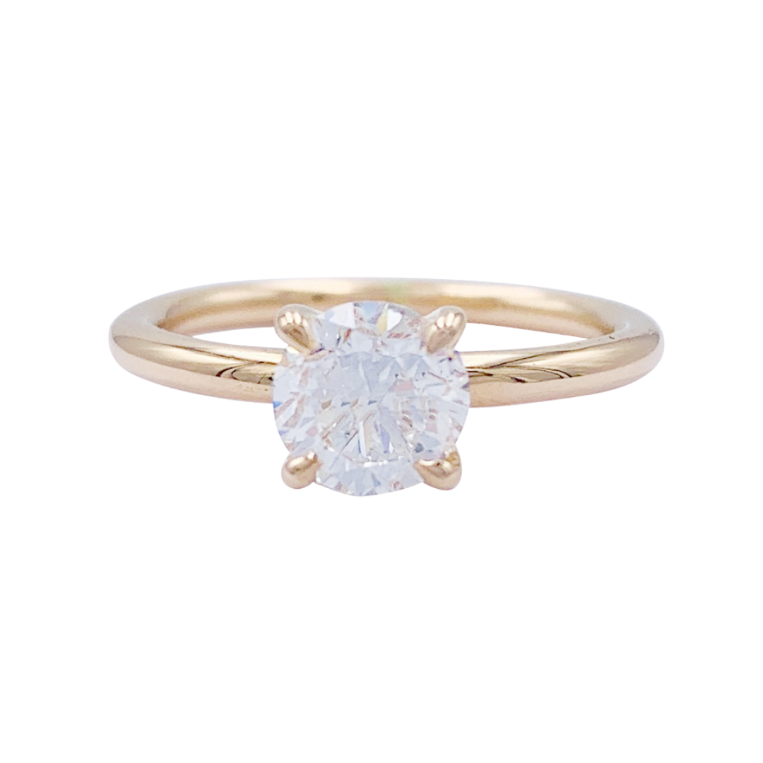 Bague solitaire en or rose, diamant 1 carat.