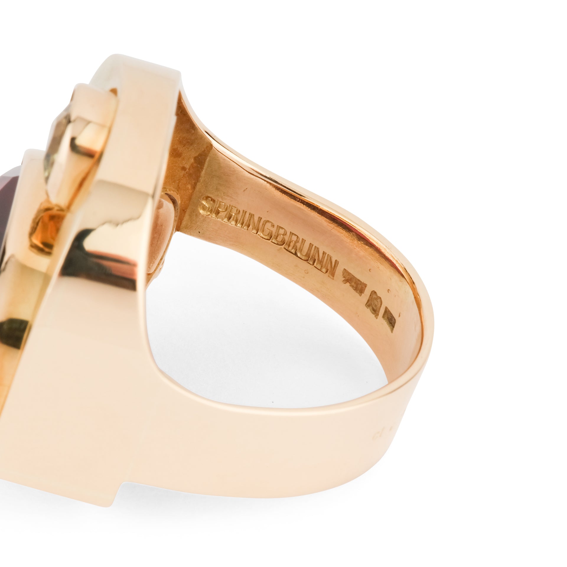 An Erwin Springbrunn ring in yellow gold, red and green garnet