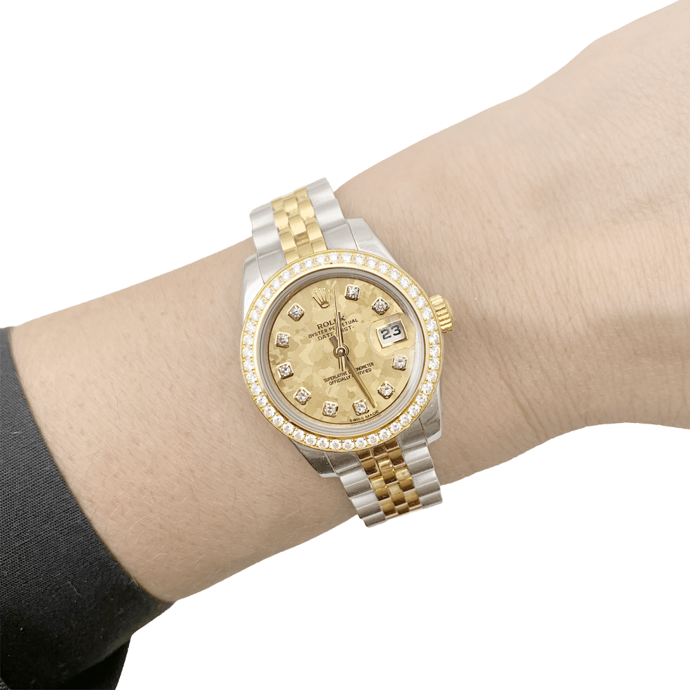 Montre Rolex, "Oyster Perpetual Lady-Datejust", or jaune, acier, diamants.