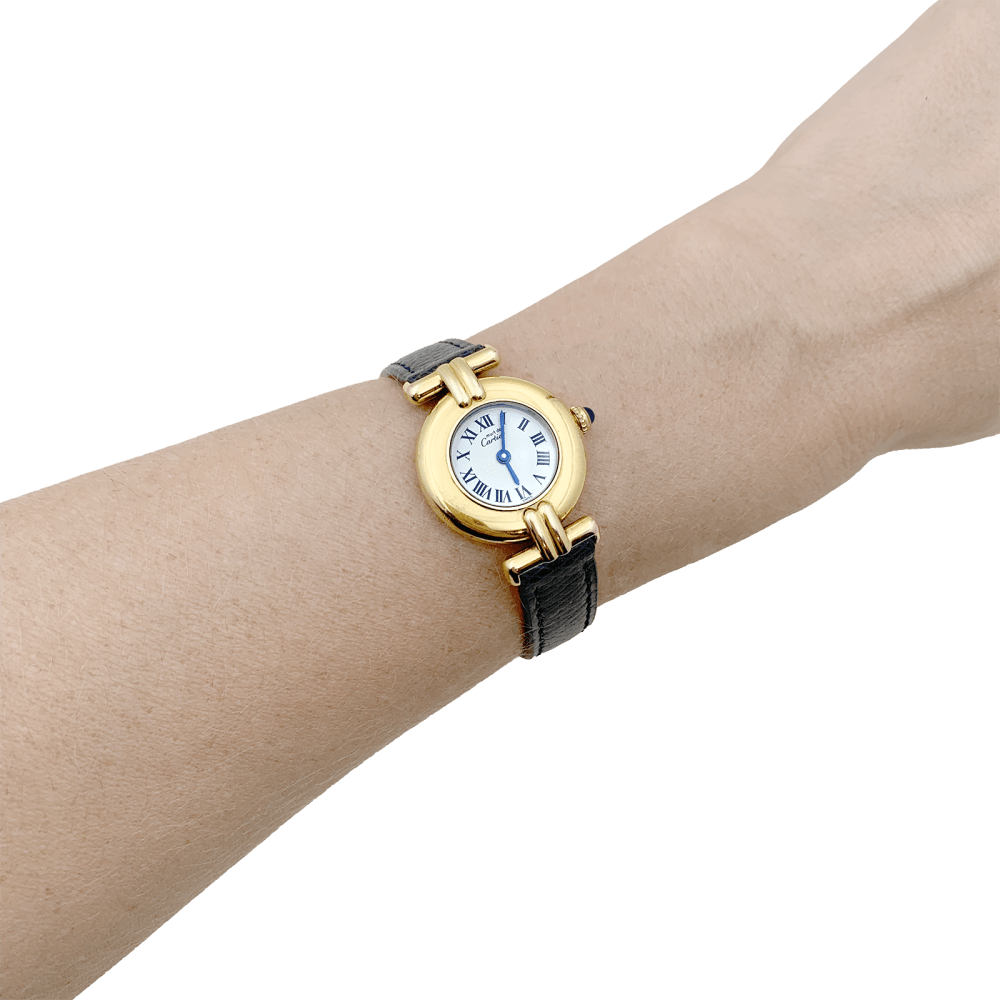 Montre Cartier, "Colisée Must", argent plaqué or, cuir.