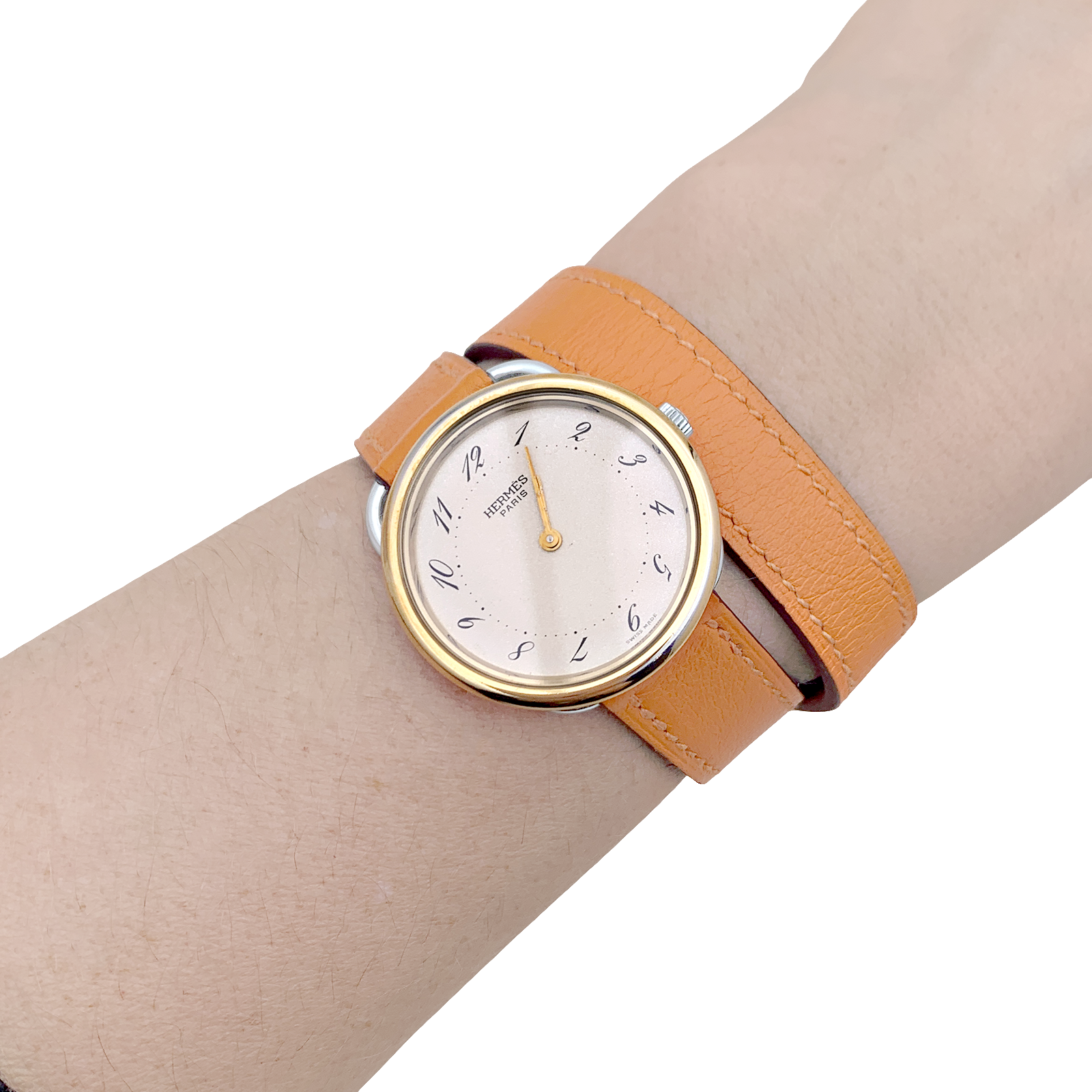 Montre Hermès, "Arceau", plaqué or, acier, cuir.