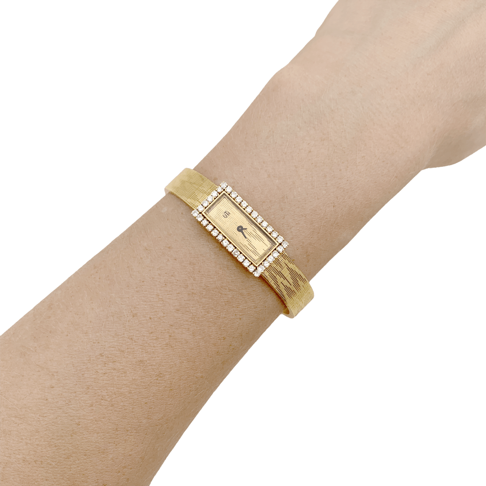 Montre vintage UTI, mouvement Blancpain, or jaune, diamants.