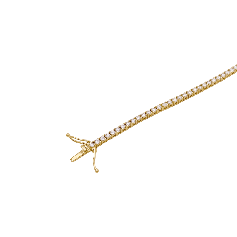 Bracelet ligne, or jaune et diamants.