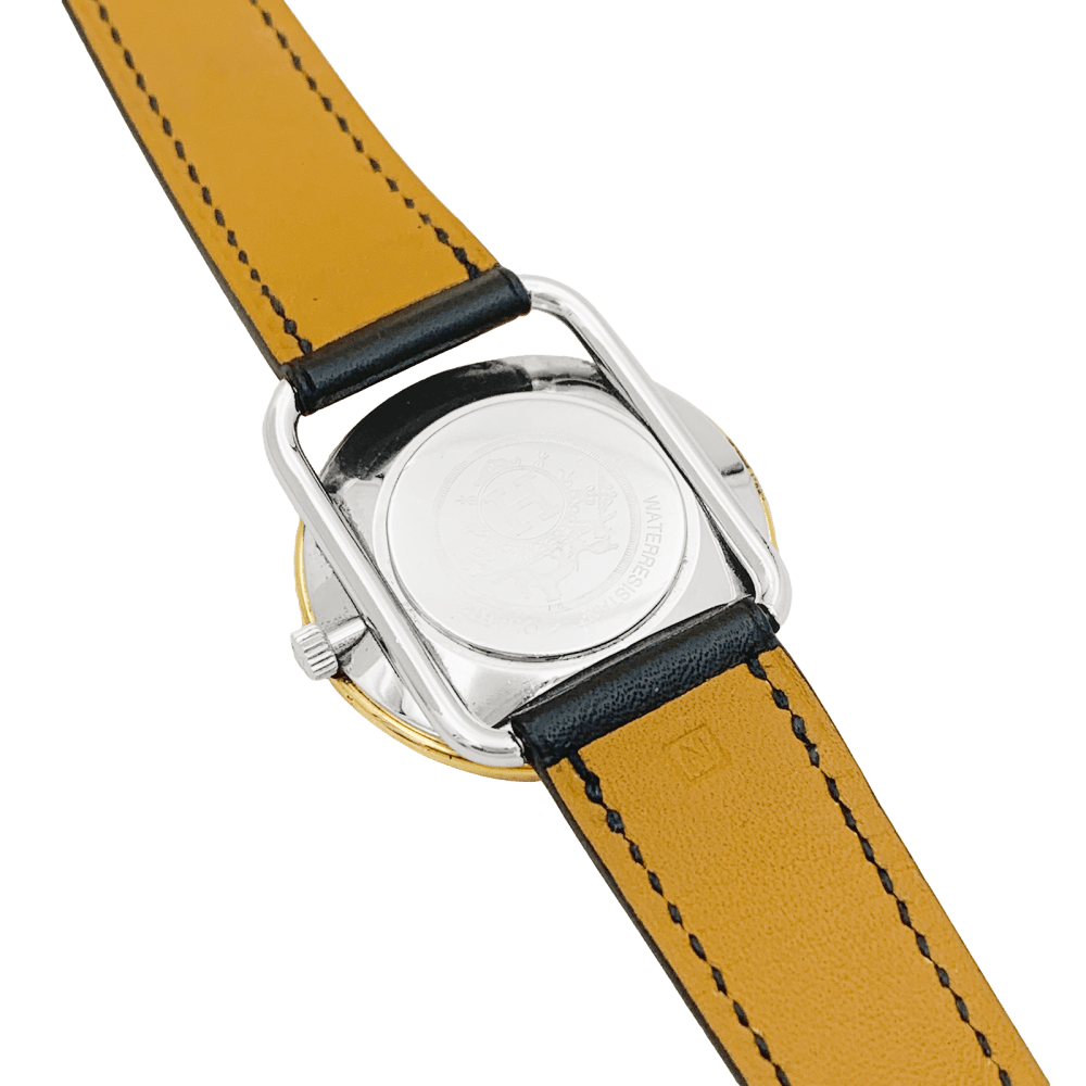 Montre HERMÈS, "Arceau", plaqué or et acier.