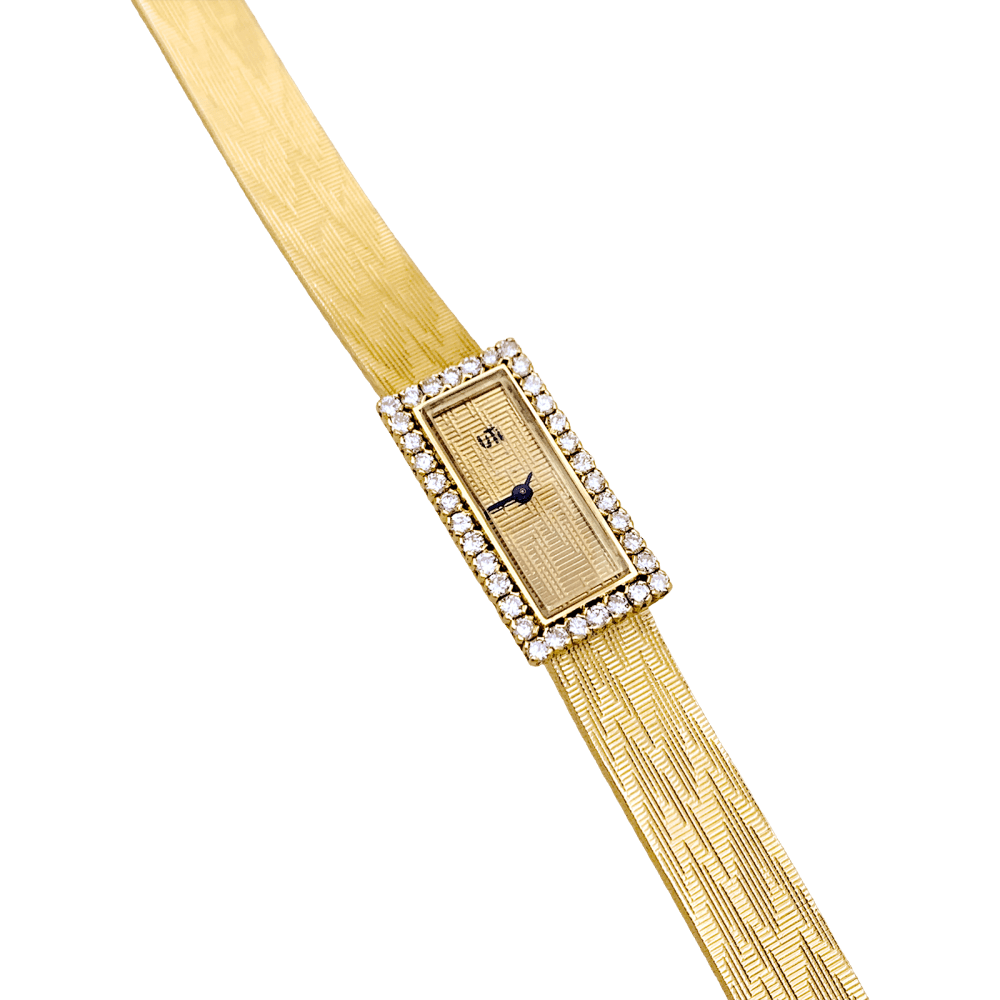 Montre vintage UTI, mouvement Blancpain, or jaune, diamants.