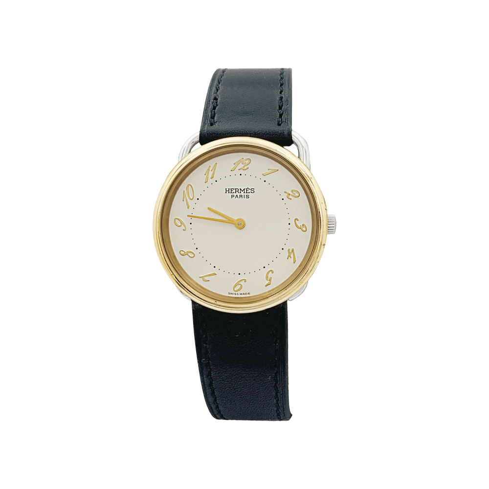 Montre HERMÈS, "Arceau", plaqué or et acier.