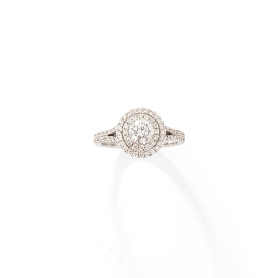 Bague solitaire en or blanc et ornée de diamants taille brillant. - Maison Eloe