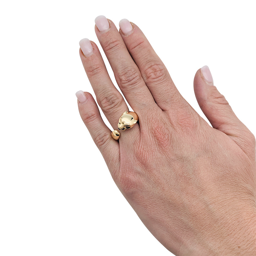 Bague Cartier "Panthère" en or jaune, grenats et onyx.