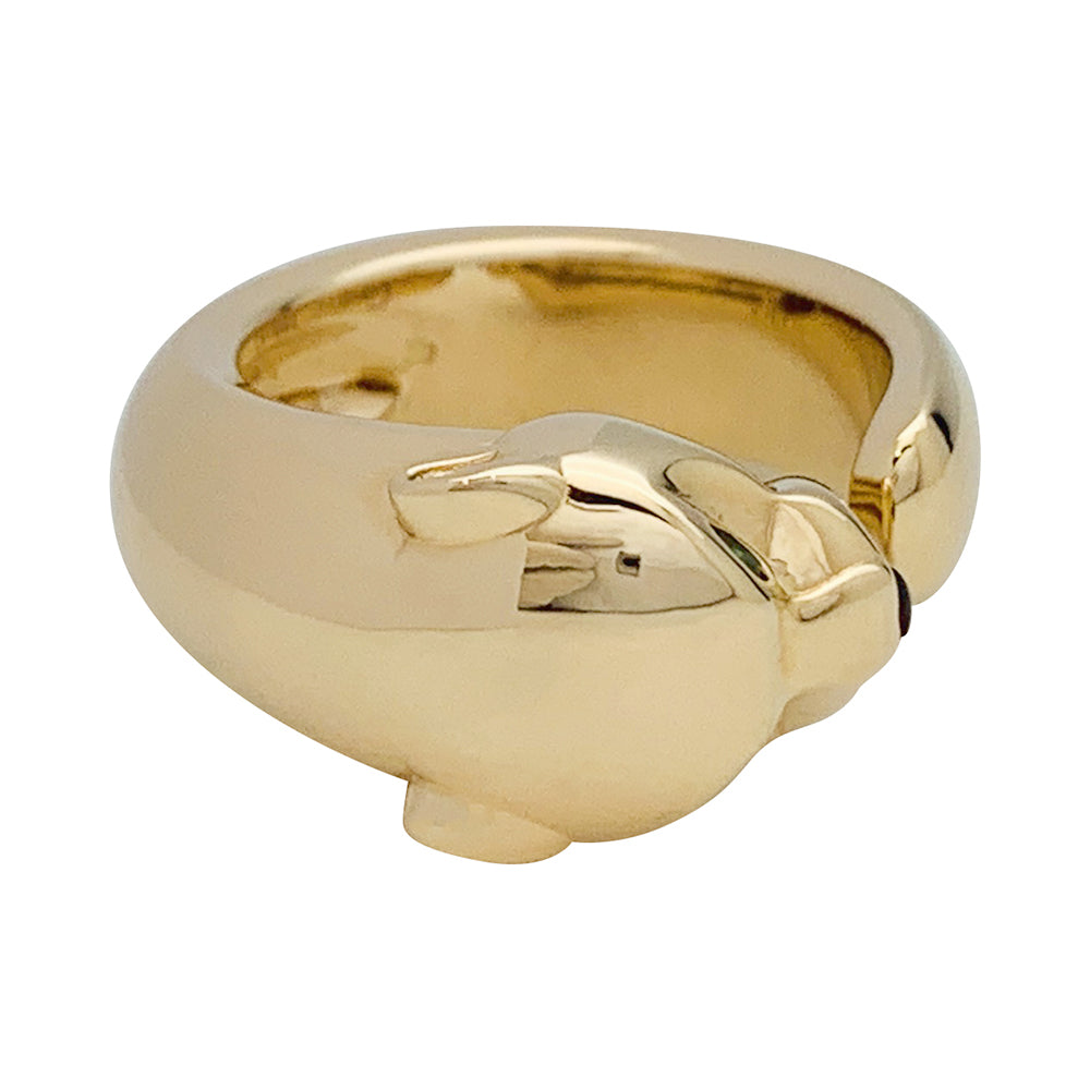 Bague Cartier "Panthère" en or jaune, grenats et onyx.