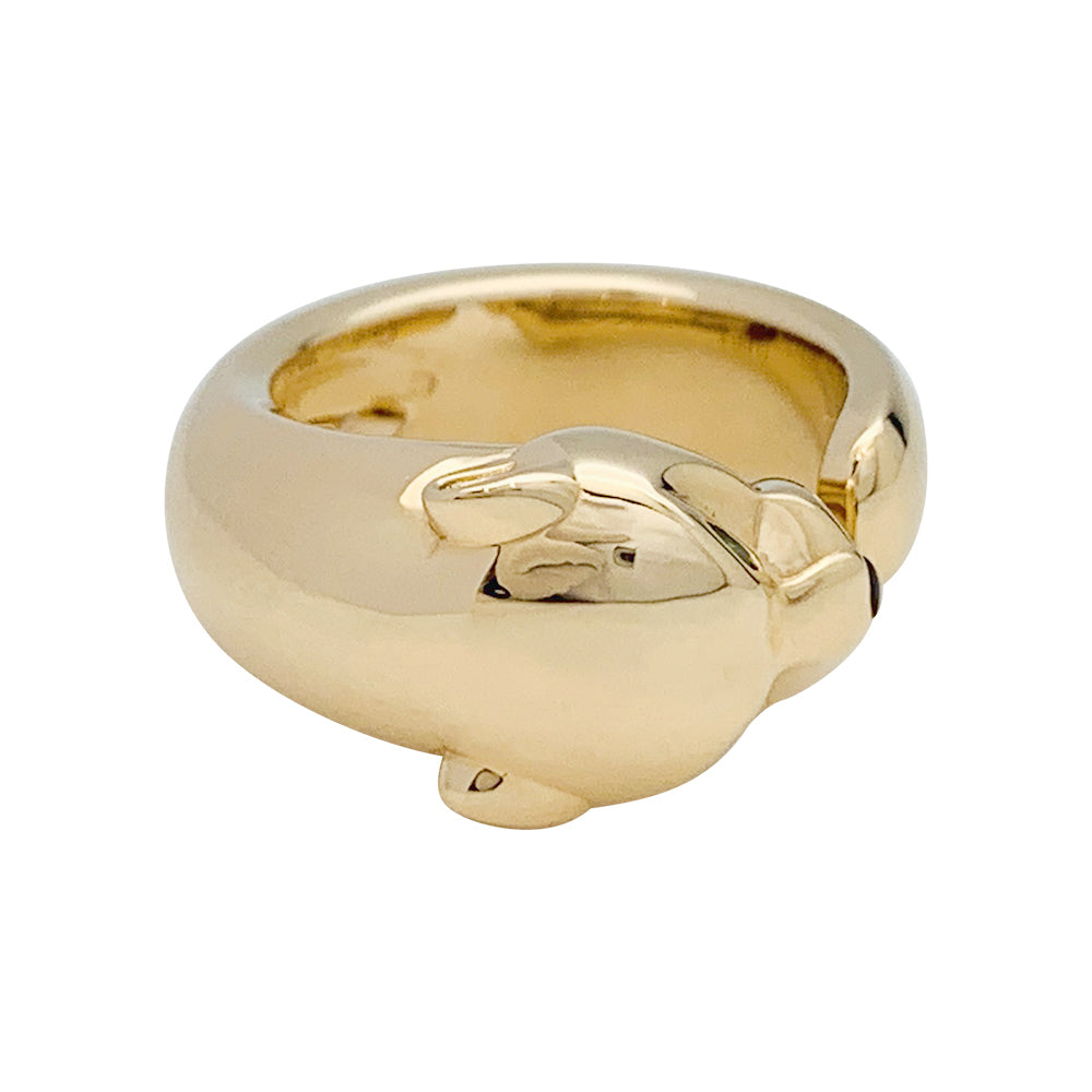 Bague Cartier "Panthère" en or jaune, grenats et onyx.