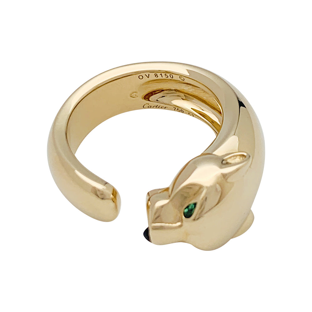 Bague Cartier "Panthère" en or jaune, grenats et onyx.