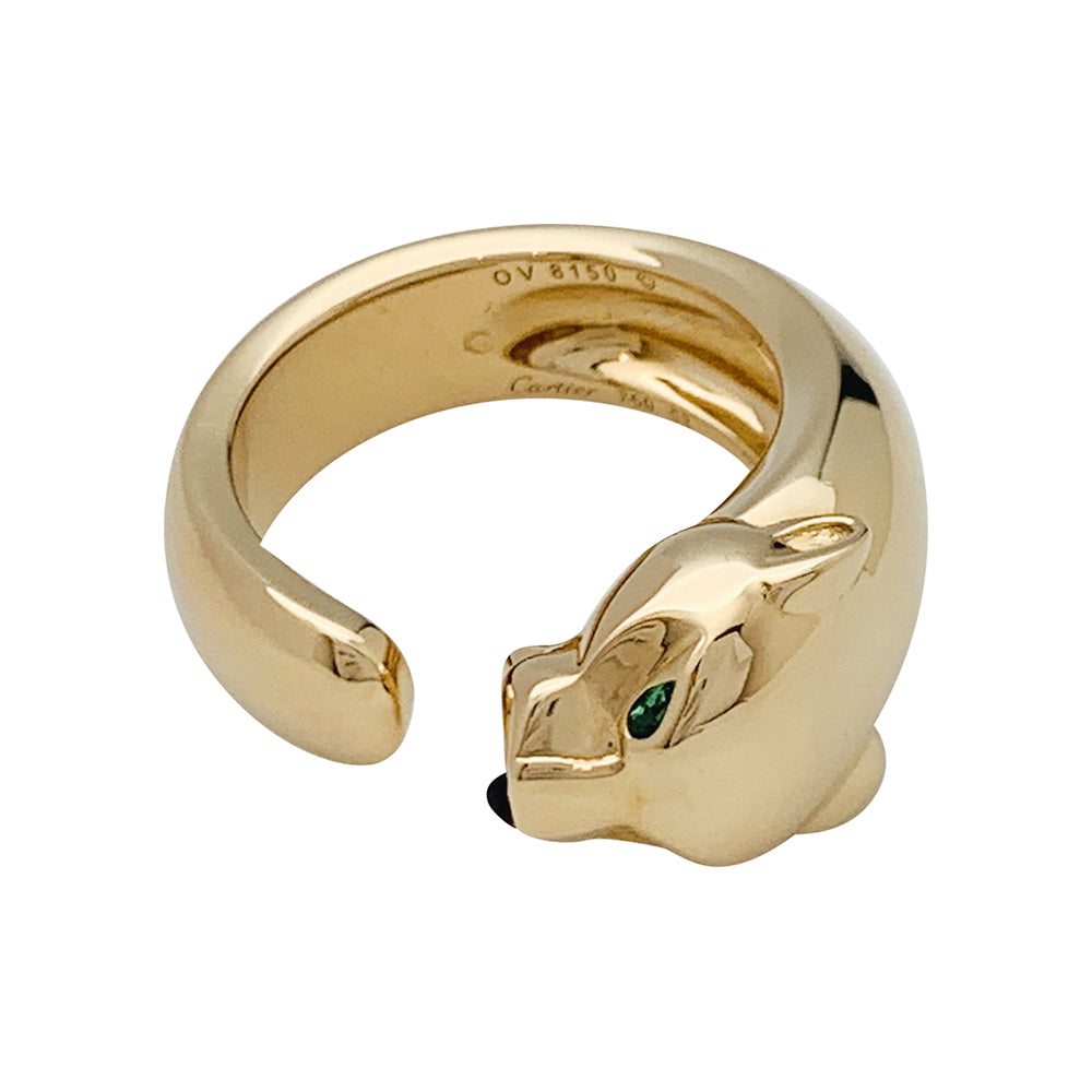 Bague Cartier "Panthère" en or jaune, grenats et onyx.