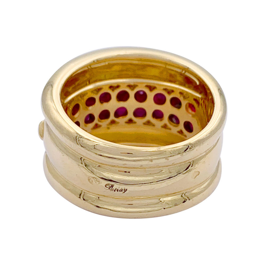 Poiray ring in yellow gold, rubies, diamonds.