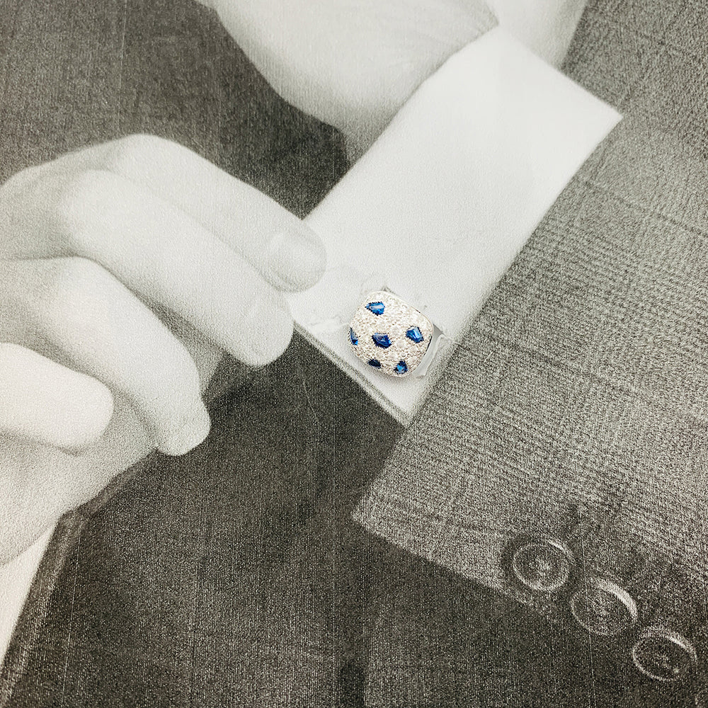 Cartier "Panther" cufflinks in white gold and diamonds.