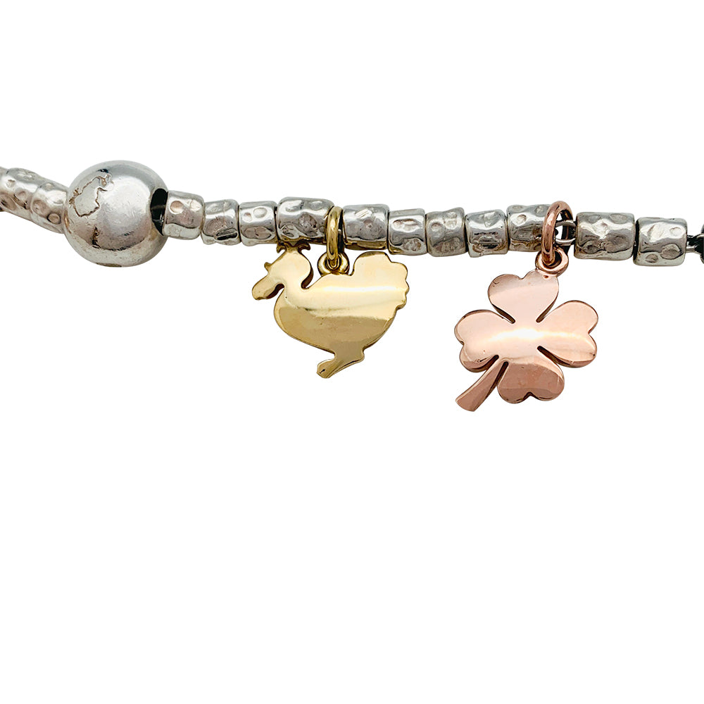 Dodo charm bracelet, silver and gold.