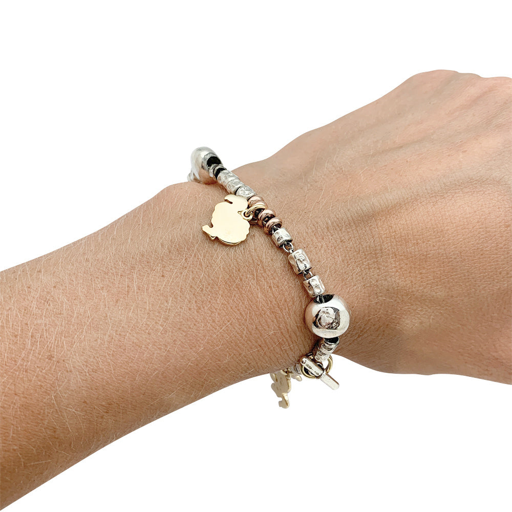 Dodo charm bracelet, silver and gold.
