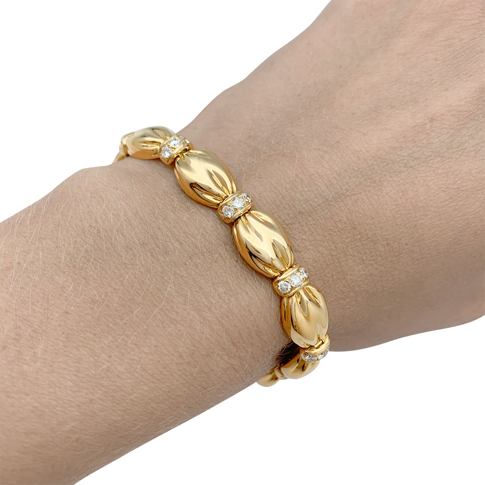 Van Cleef &amp; Arpels bracelet, "Drapé", yellow gold, diamonds.