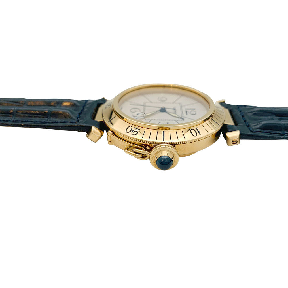 Cartier "Pasha" watch in yellow gold, leather.