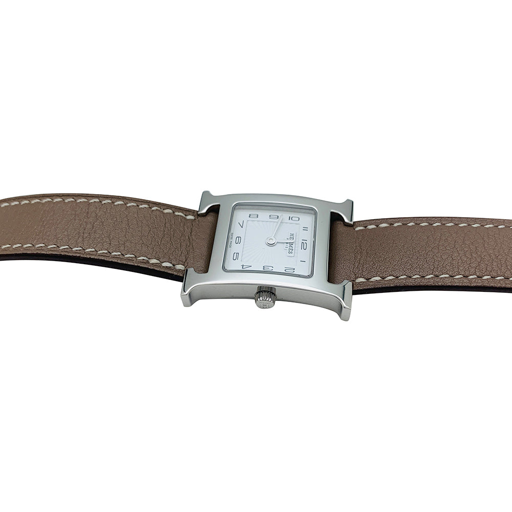 Hermès "Heure H" watch in steel and leather.
