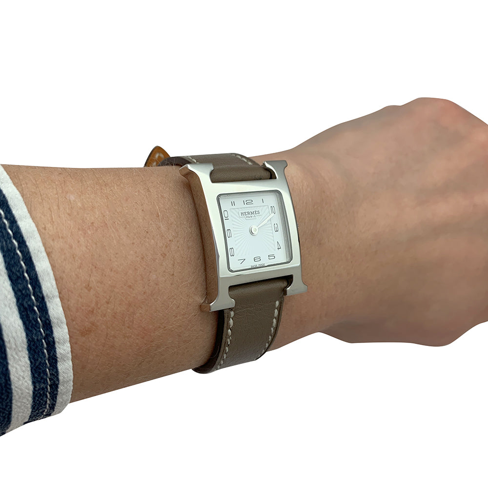 Hermès "Heure H" watch in steel and leather.