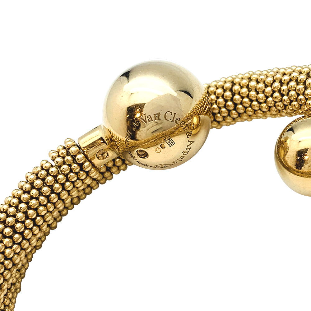 Van Cleef &amp; Arpels "Liane Serpent" three-turn watch in yellow gold.